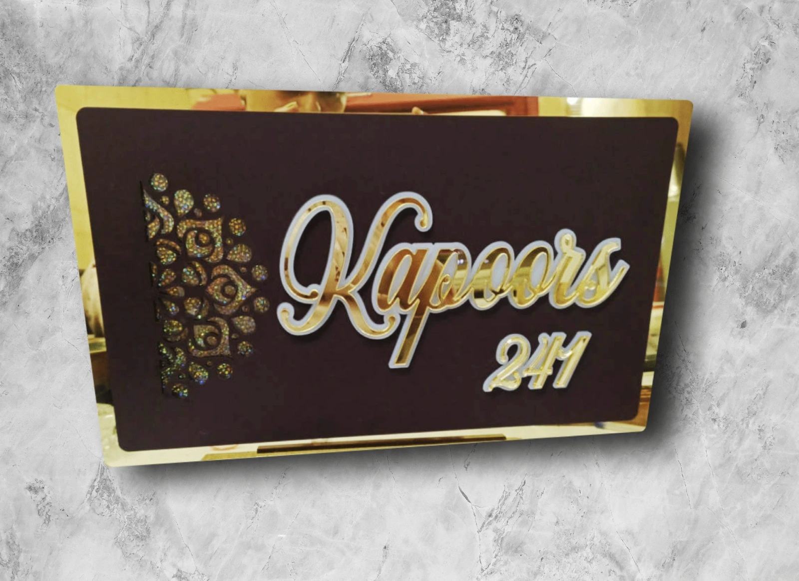 Dark brown nameplate with gold acrylic